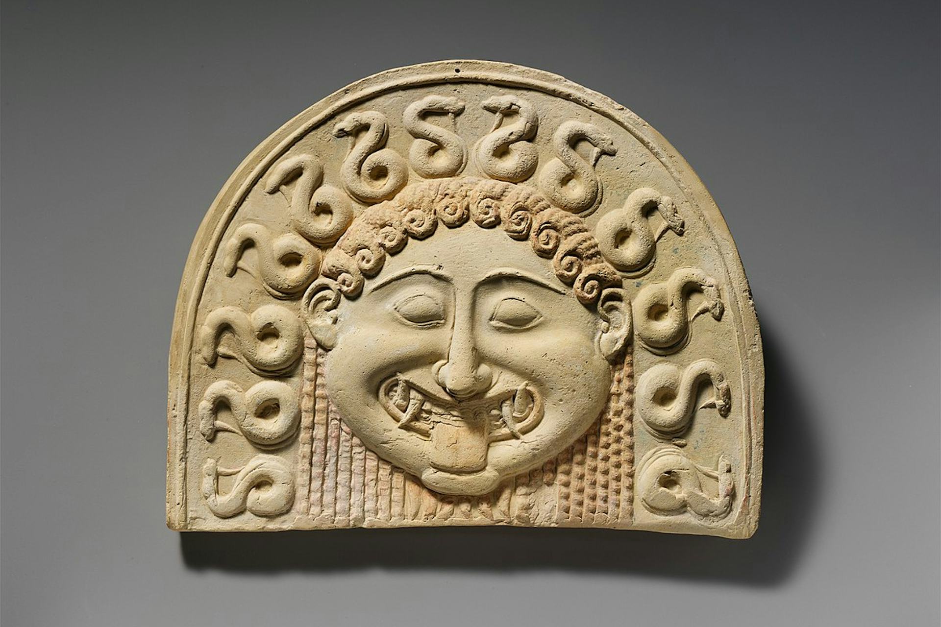 Gorgon head on terracotta tile