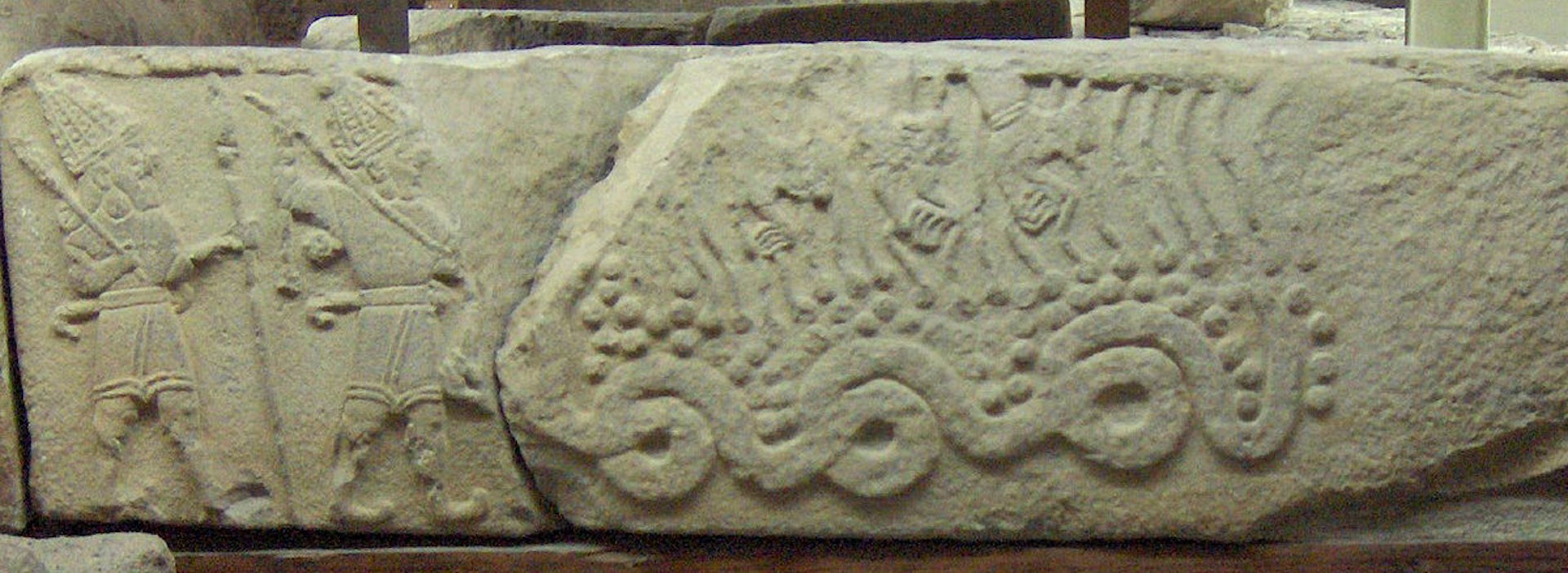 Hittite relief showing the storm god Tarhunna killing Illuyanka (ca. 850–800 BCE).