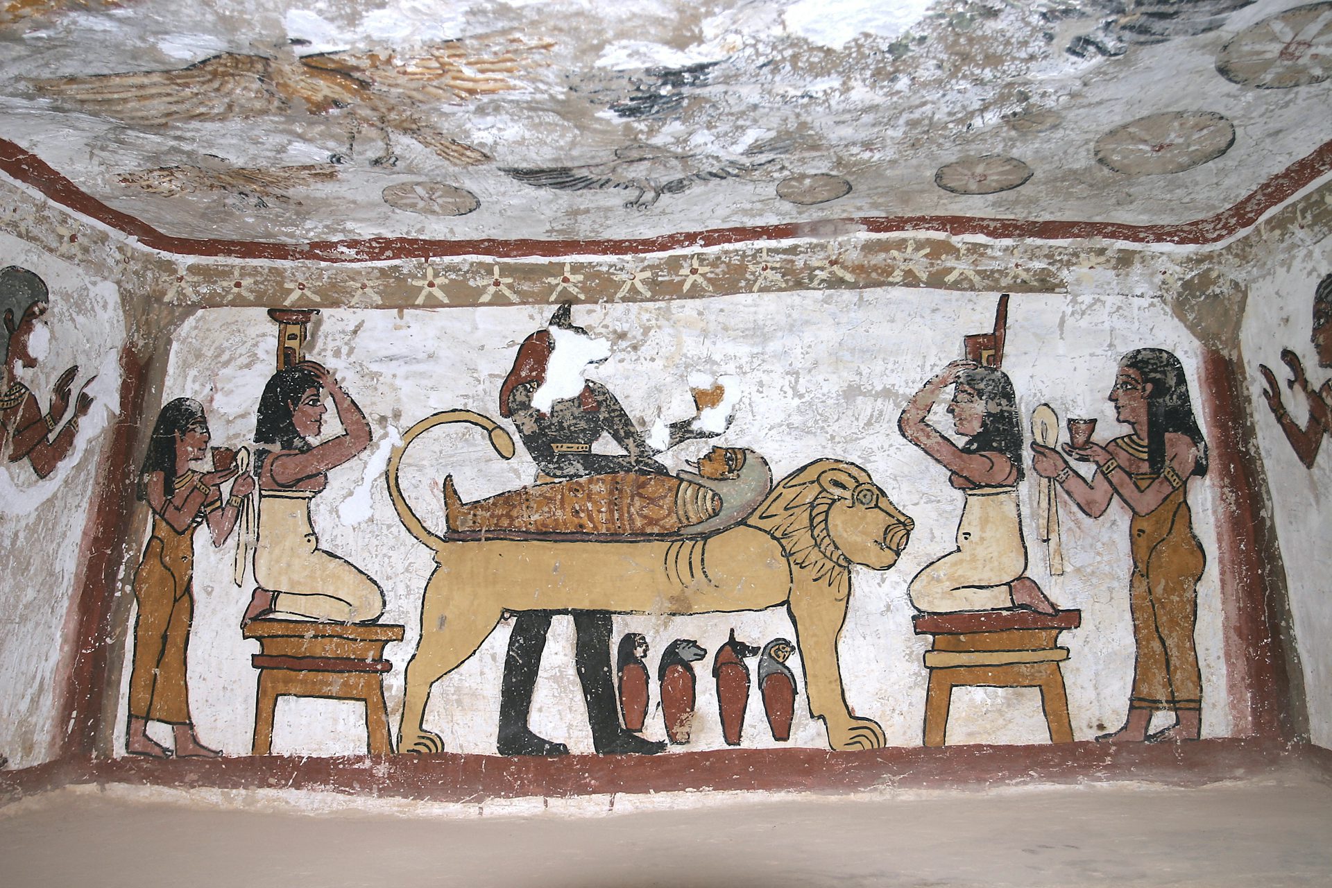 Painting from the tomb at Muzawaka depicting Nephthys and Isis kneeling by a corpse. 