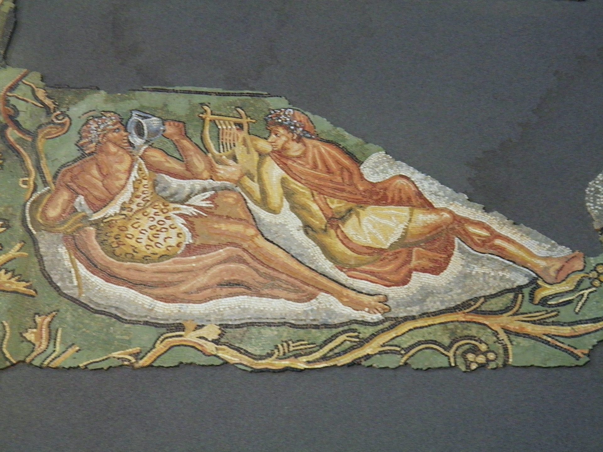 Mosaic detail of Bacchus reclining with lyre player