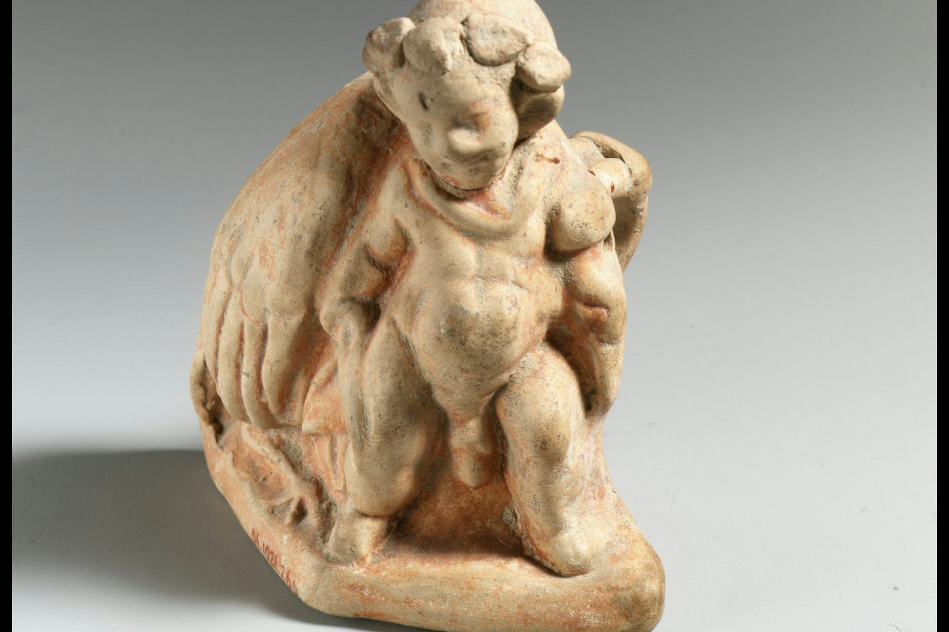 Terracotta vase in the form of a pygmy carrying a dead crane