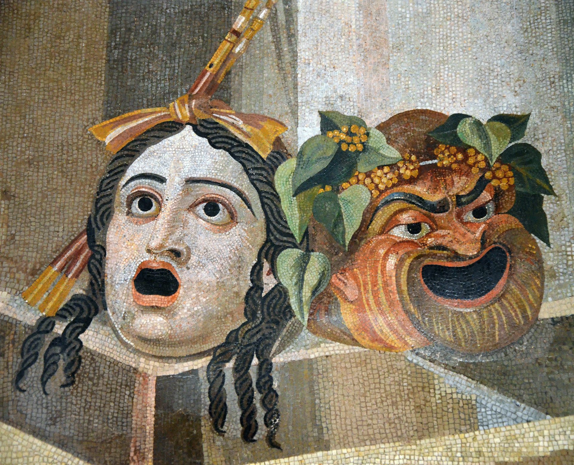 Roman mosaic of the theatrical masks of tragedy and comedy
