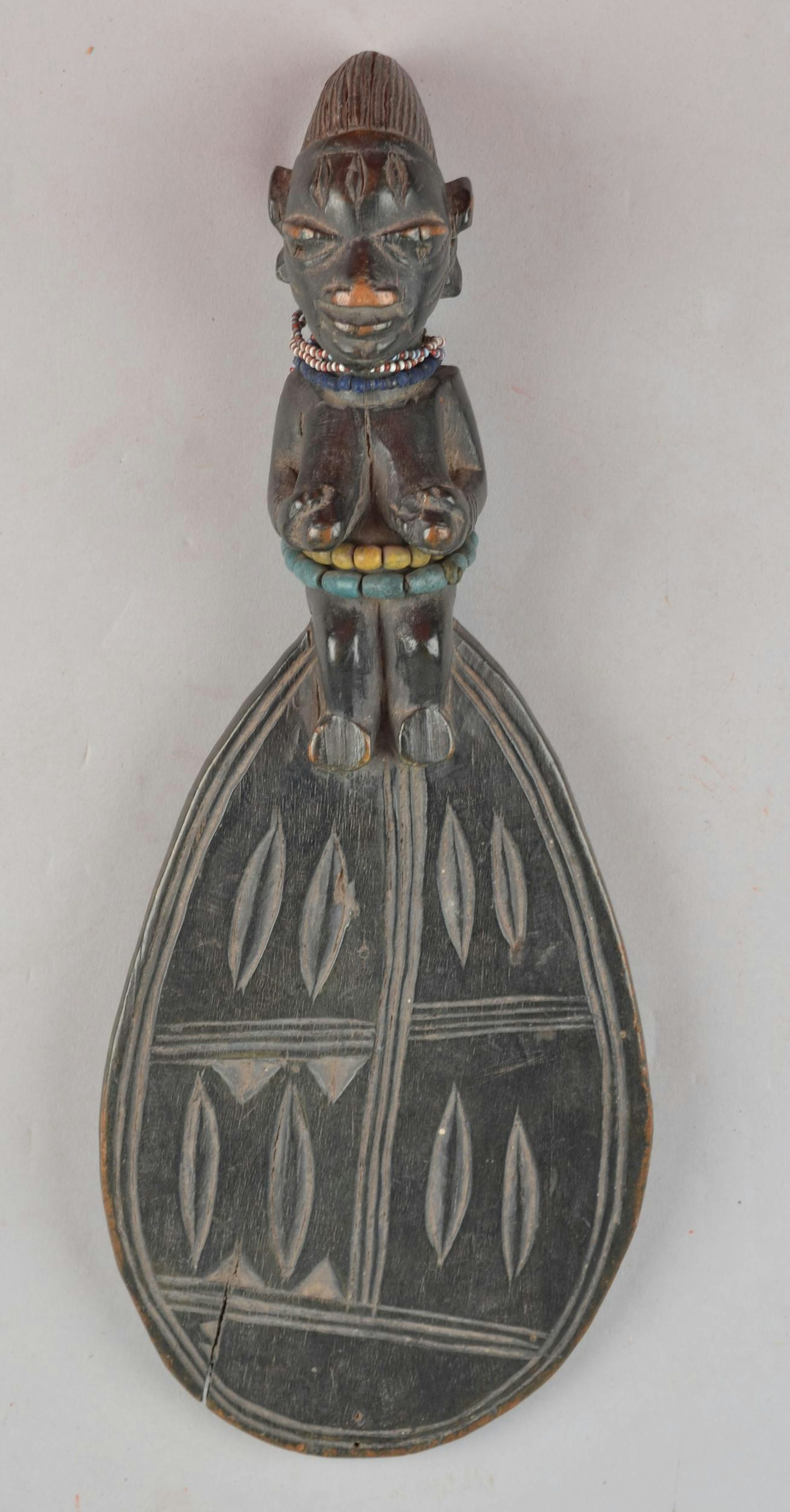 Carved female figure, by Yoruba artist (n.d)