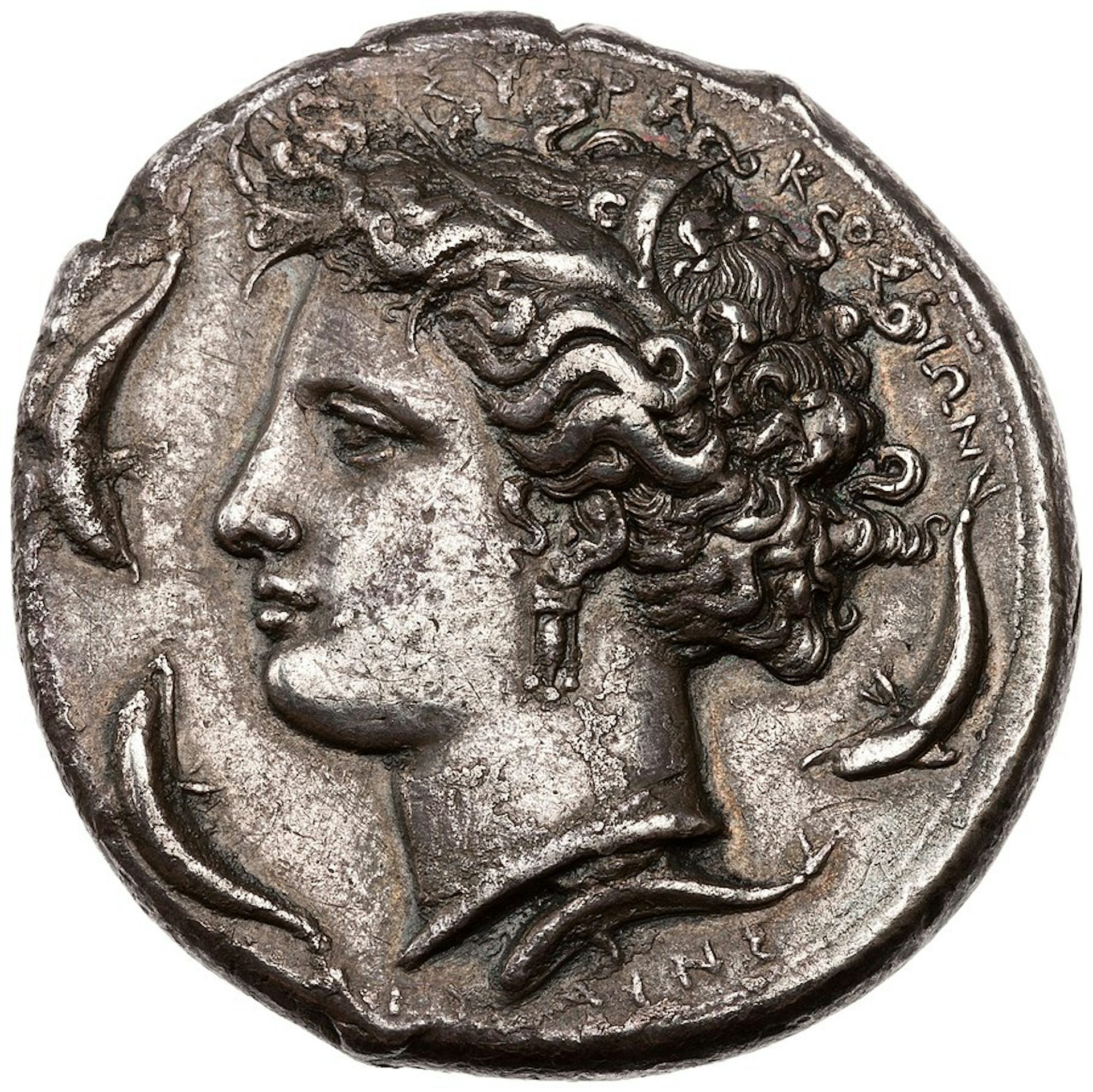 Silver decadrachm showing the head of Arethusa surrounded by leaping dolphins